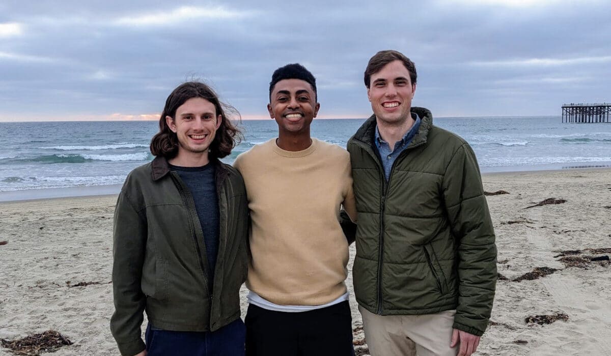 Three co-founders on a beach