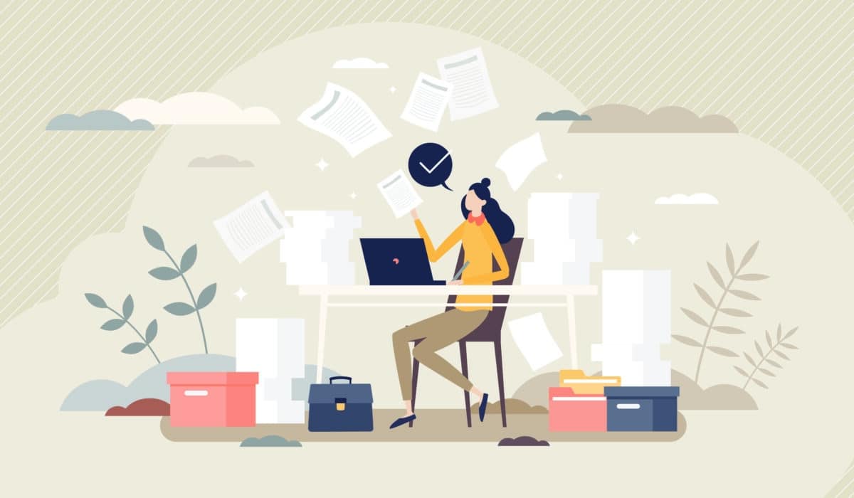 An illustration of a female looking at paperwork and multitasking in a business setting