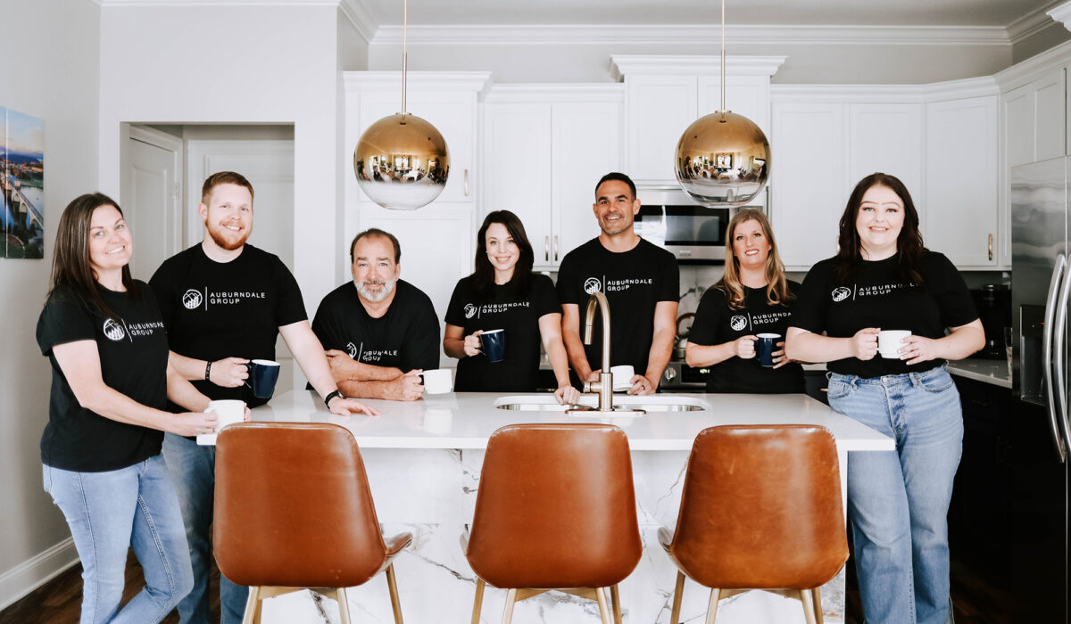 Adrienne Green, founder, and the Auburndale Group team