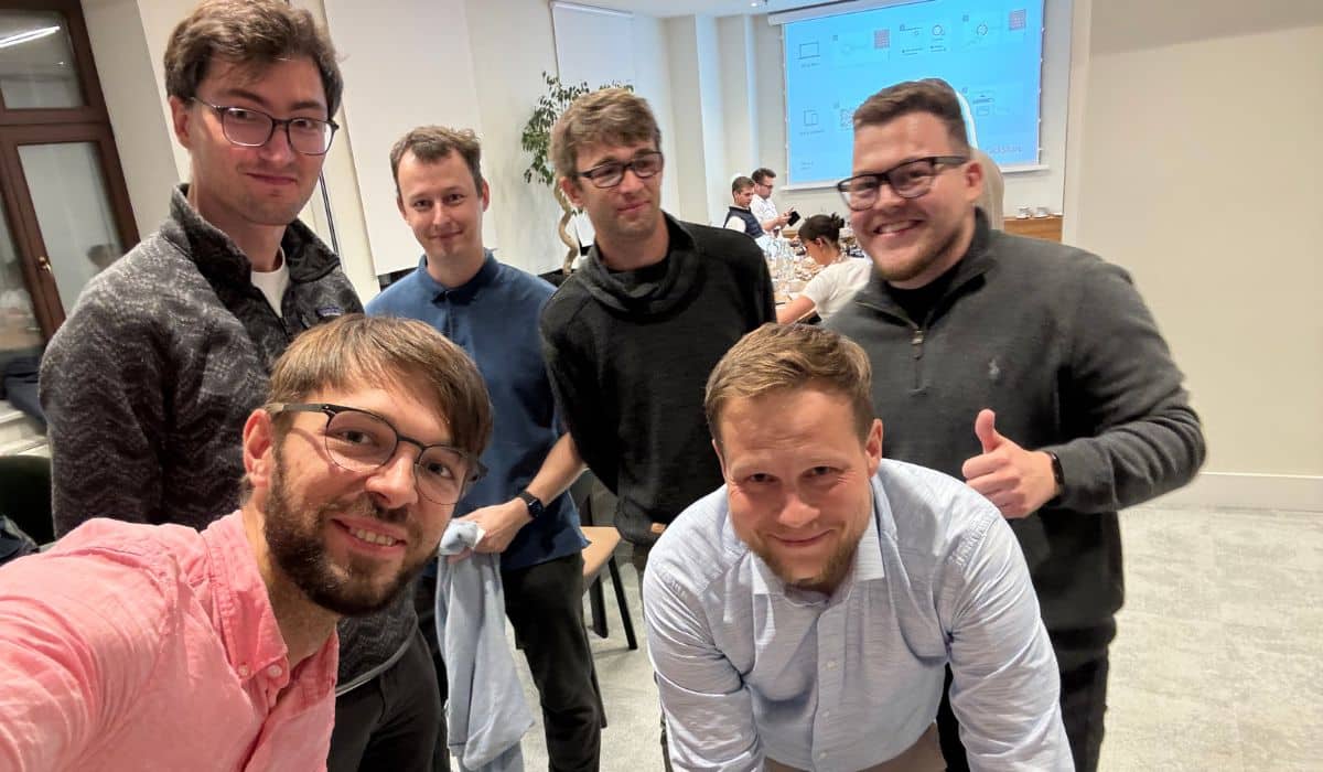 The Surfer SEO team after the transaction: Top row (left to right): Bartek Korpus (CTO), Mateusz Tunski (First Engineer), Michal Suski (Co-Founder), Tom Niezgoda (Co-Founder) Bottom row (left to right): Lucjan Suski (Co-Founder), Mateusz Zielinski (Head of Legal)