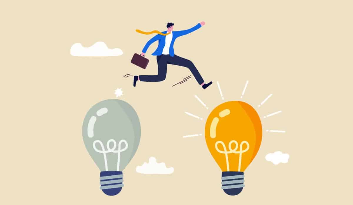 A businessman jumping from a dull grey light bulb to a bright glowing one, representing a shift to a better idea.